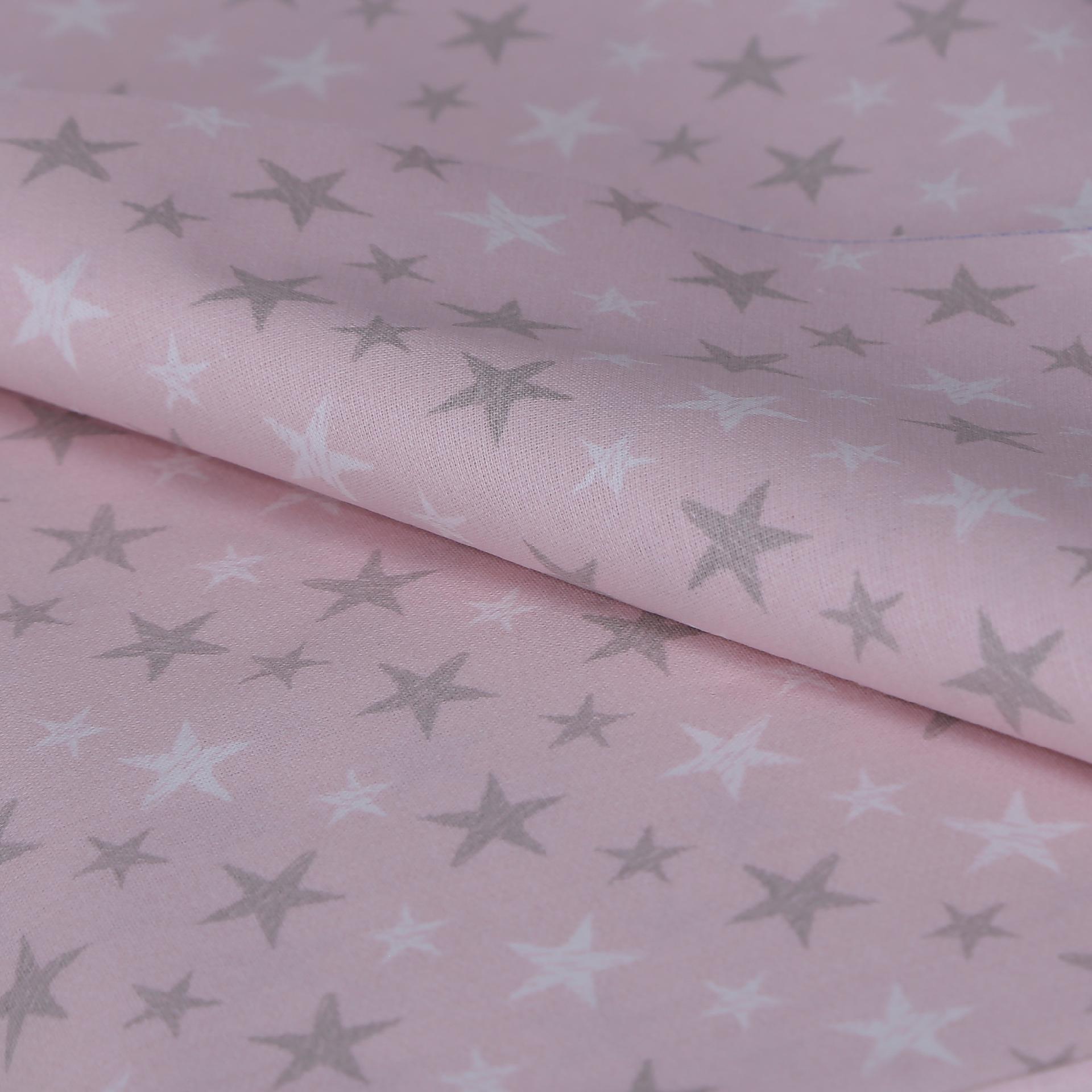 stoffa cotone tinta rosa con stelle di colore bianco e grigio