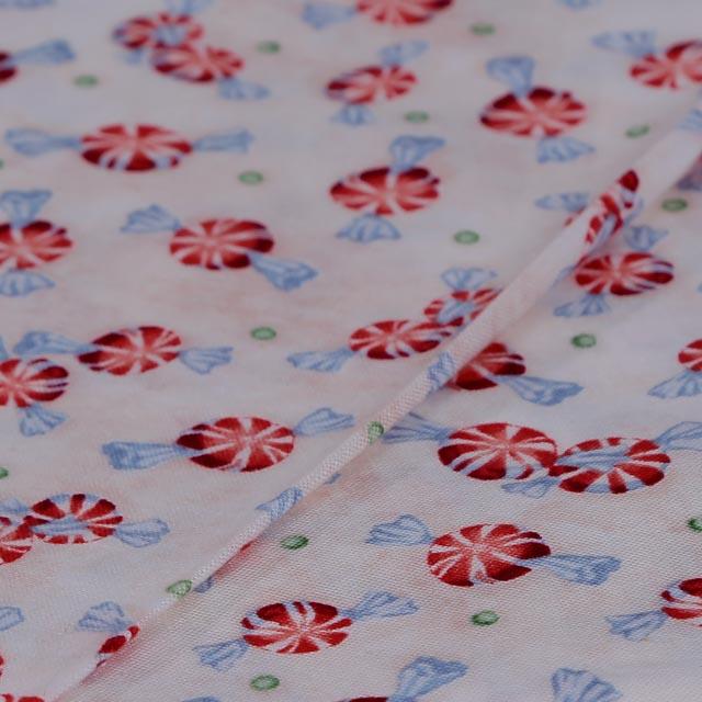 Stoffa Natalizia  con fondo bianco rosato e caramelle stafil 140 cm x 50 cm
