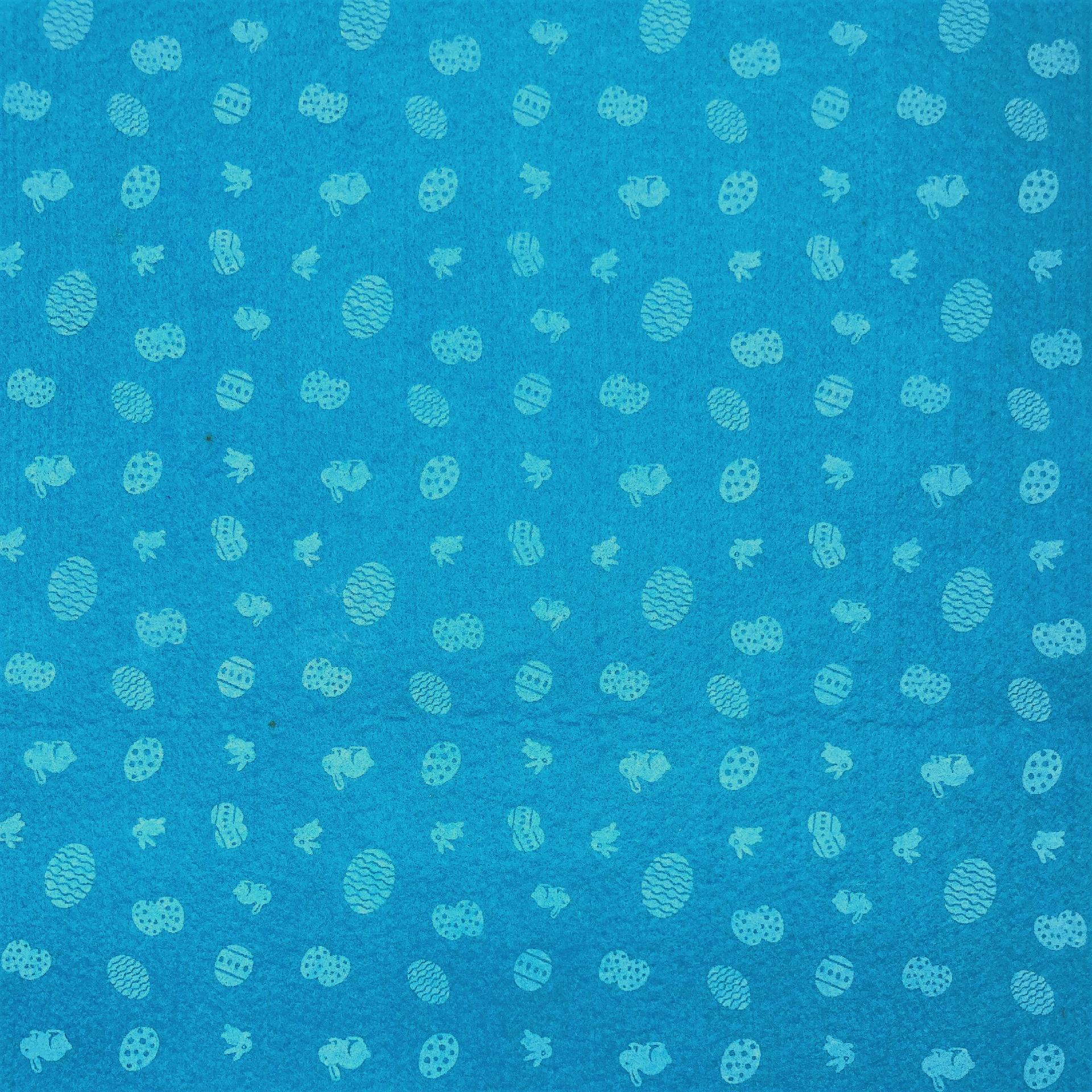 pannolenci stampato turchese con piccoli decori di  uova pasquali e conigli stafil 30 x 40 cm