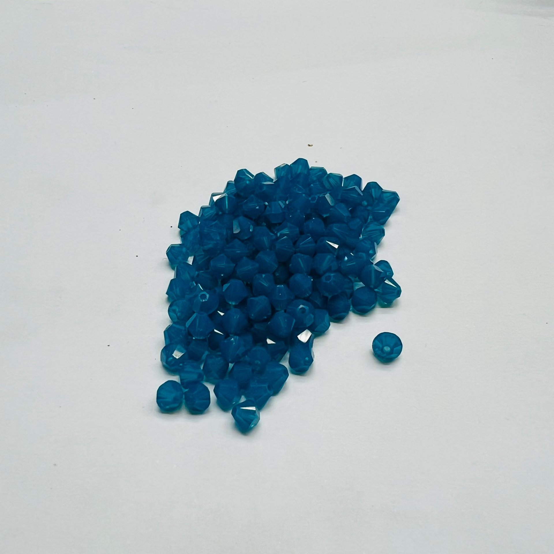 Swarovski bicono Caribbean Blue Opal 3 mm swarovski busta da 100pz
