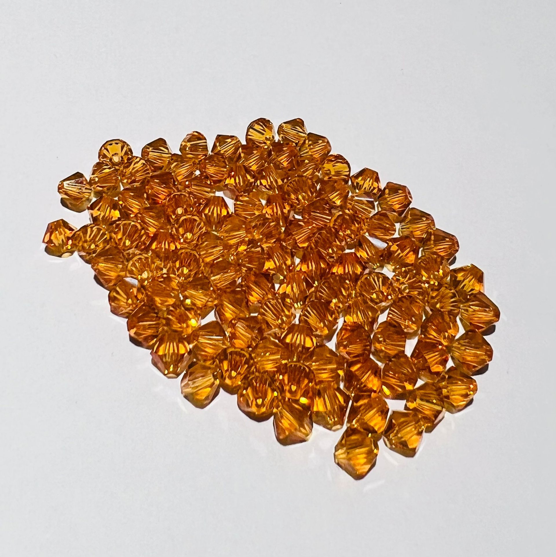 Swarovski bicono Topaz 3 mm swarovski busta da 100pz