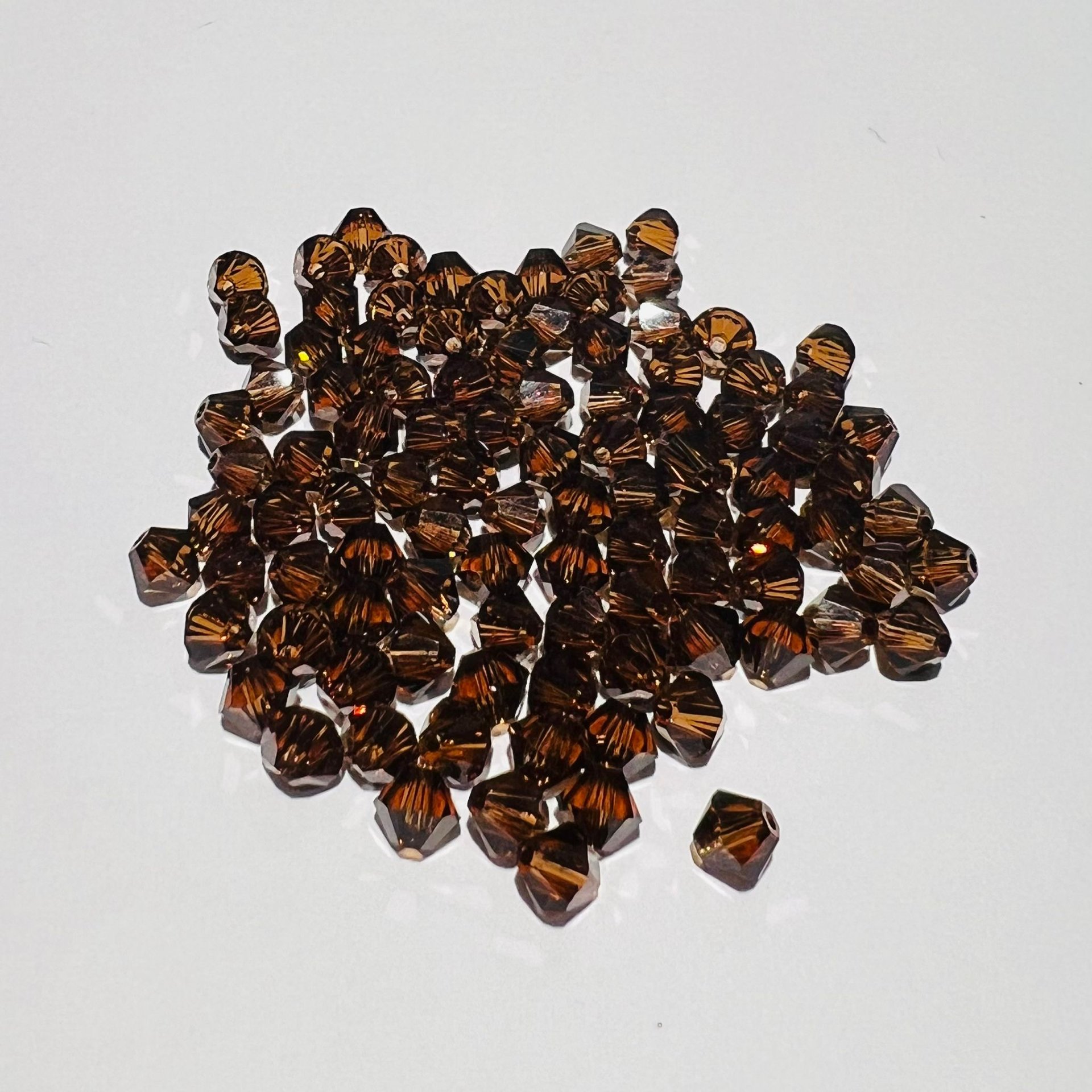 Swarovski bicono Smoked Topaz 4 mm swarovski busta da 100 pz
