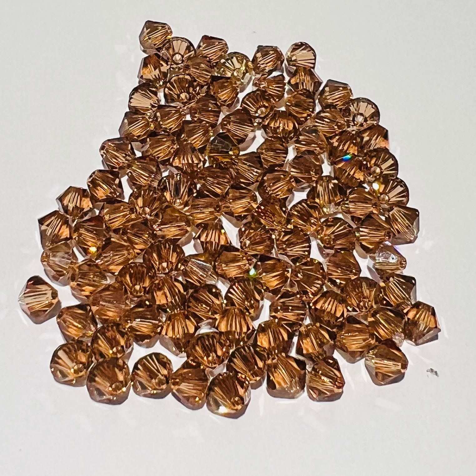 Swarovski bicono Light Smoked Topaz 6 mm swarovski busta da 50 pezzi