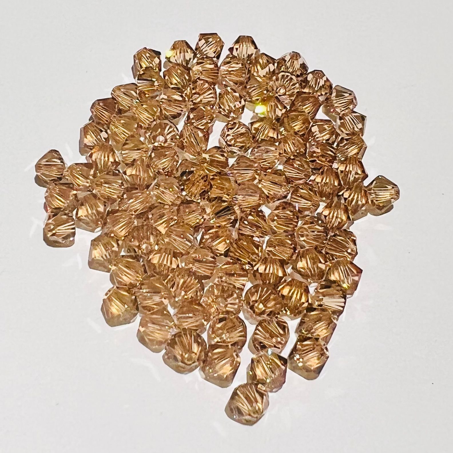 Swarovski bicono Light Colorado Topaz 4 mm swarovski busta da 100 pz