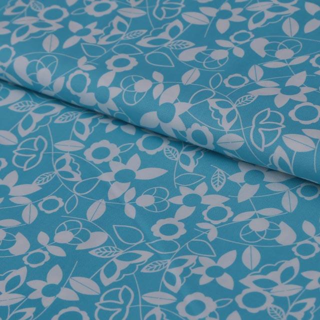 Stoffa in cotone turchese  con fantasia bianca stafil altezza 110 cm x (multipli di 50cm)