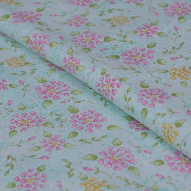 Stoffa in cotone verde acqua con fiori rosa e gialli stafil altezza 110x50 cm