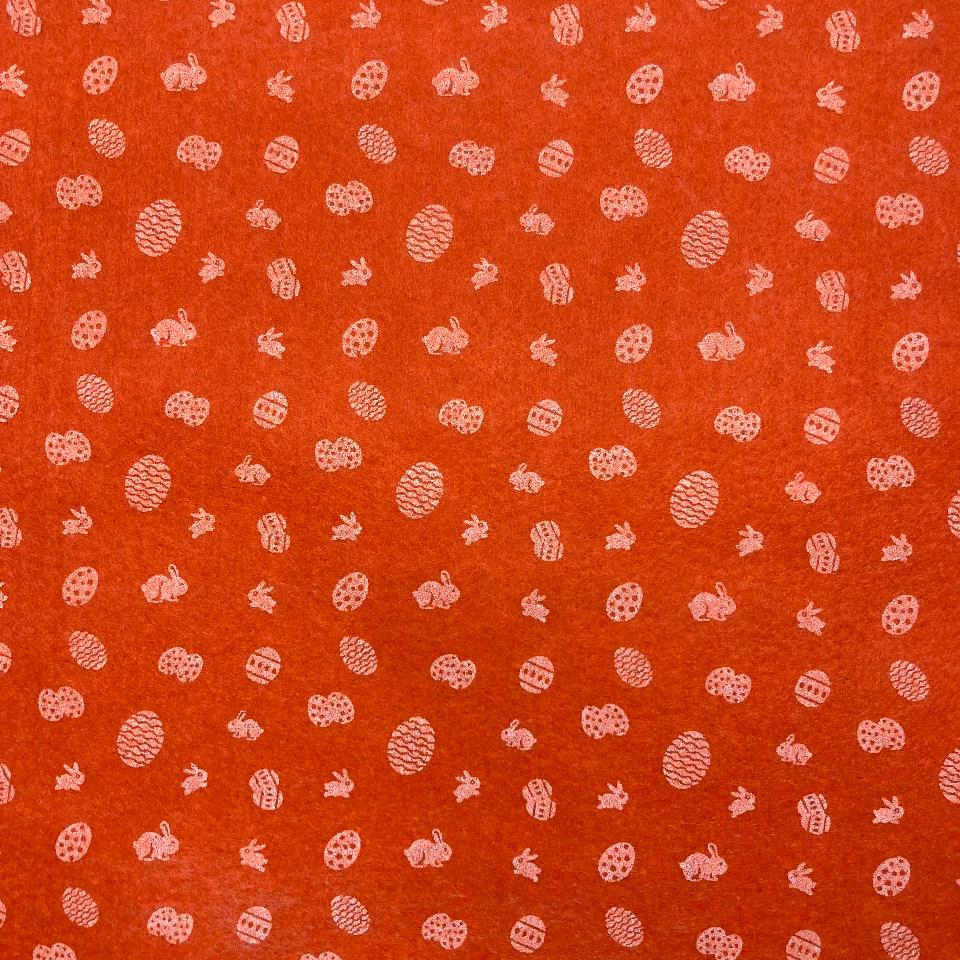 pannolenci stampato arancio con piccoli decori di uova e conigli stafil 30 x 40 cm