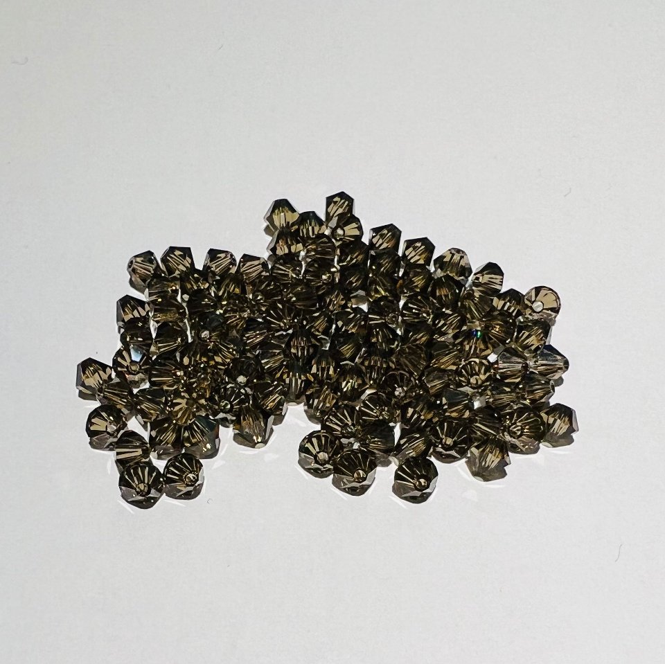 Swarovski bicono Smoky Quartz 4 mm swarovski 4 mm (busta da 100 pz)