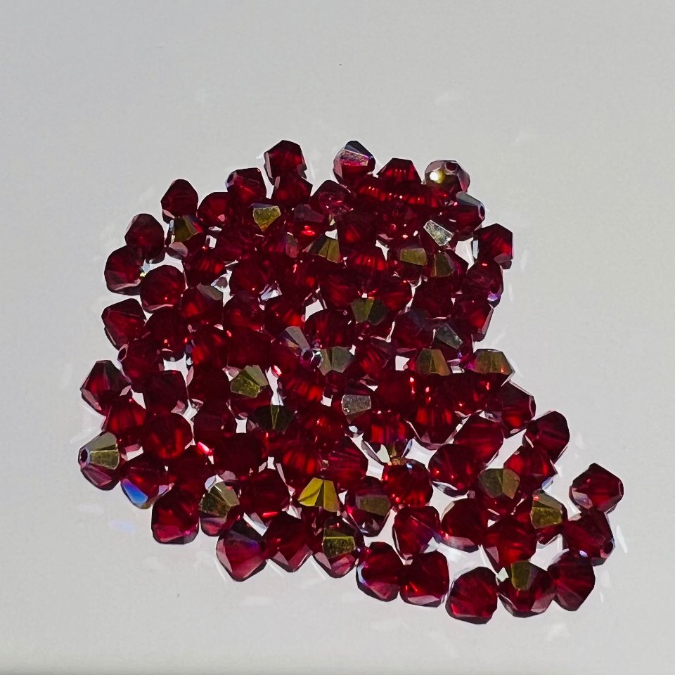 Swarovski bicono Siam 3 mm swarovski busta da 100 pz