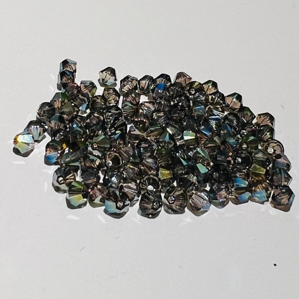 Swarovski bicono Crystal Iridescent Green 3 mm swarovski 3 mm (busta da 100 pz)