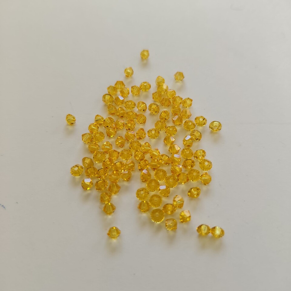 Swarovski jonquill 3 mm swarovski busta da 100pz