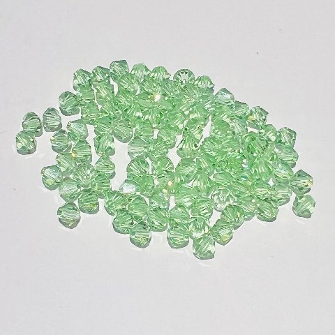 Swarovski bicono Peridot 4 mm swarovski 4 mm (busta da 100 pz)