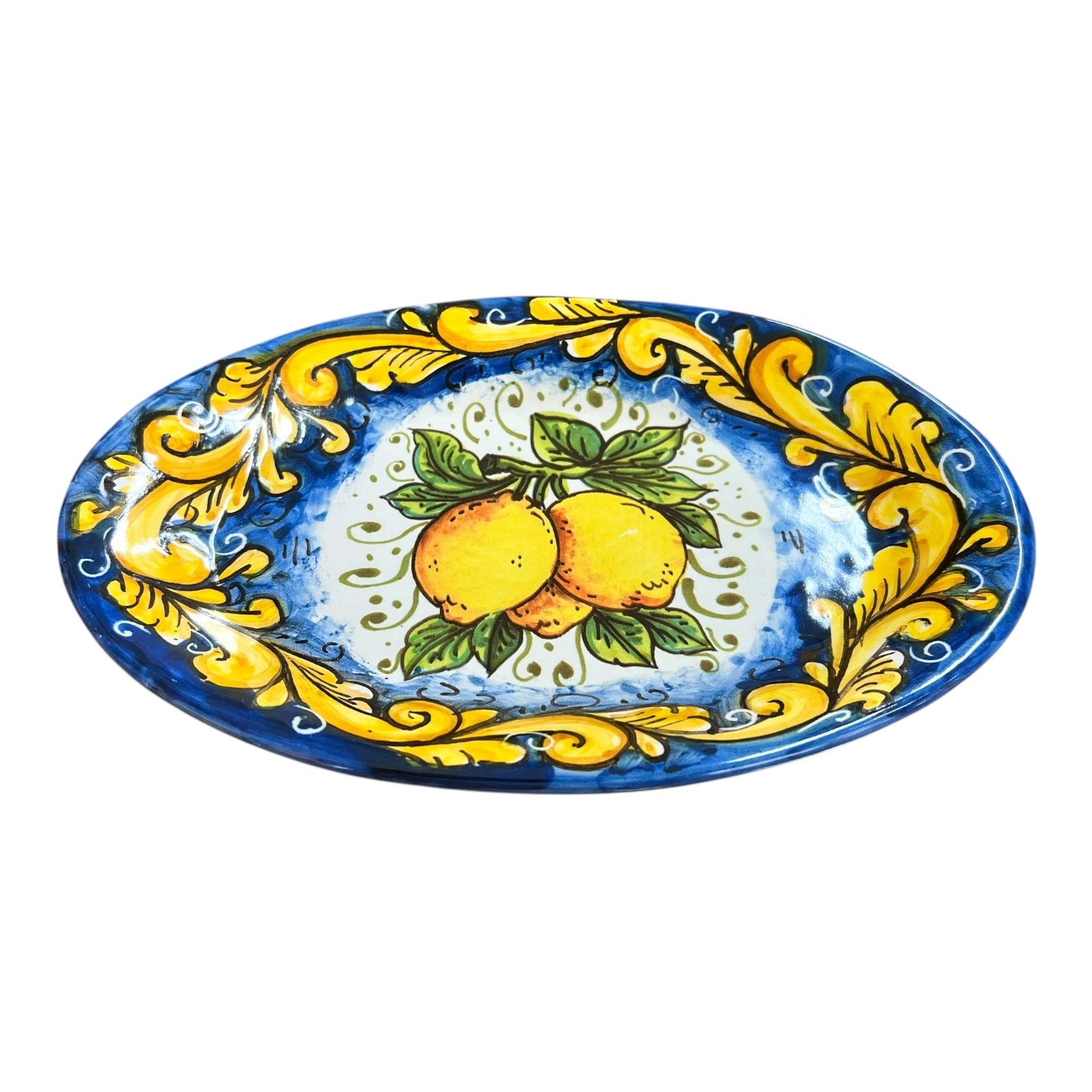 Piatto ornamentale ovale da parete con limoni decoro ornato giallo fondo blu Produzione artigianale di Santo Stefano di Camastra Lunghezza 18cm