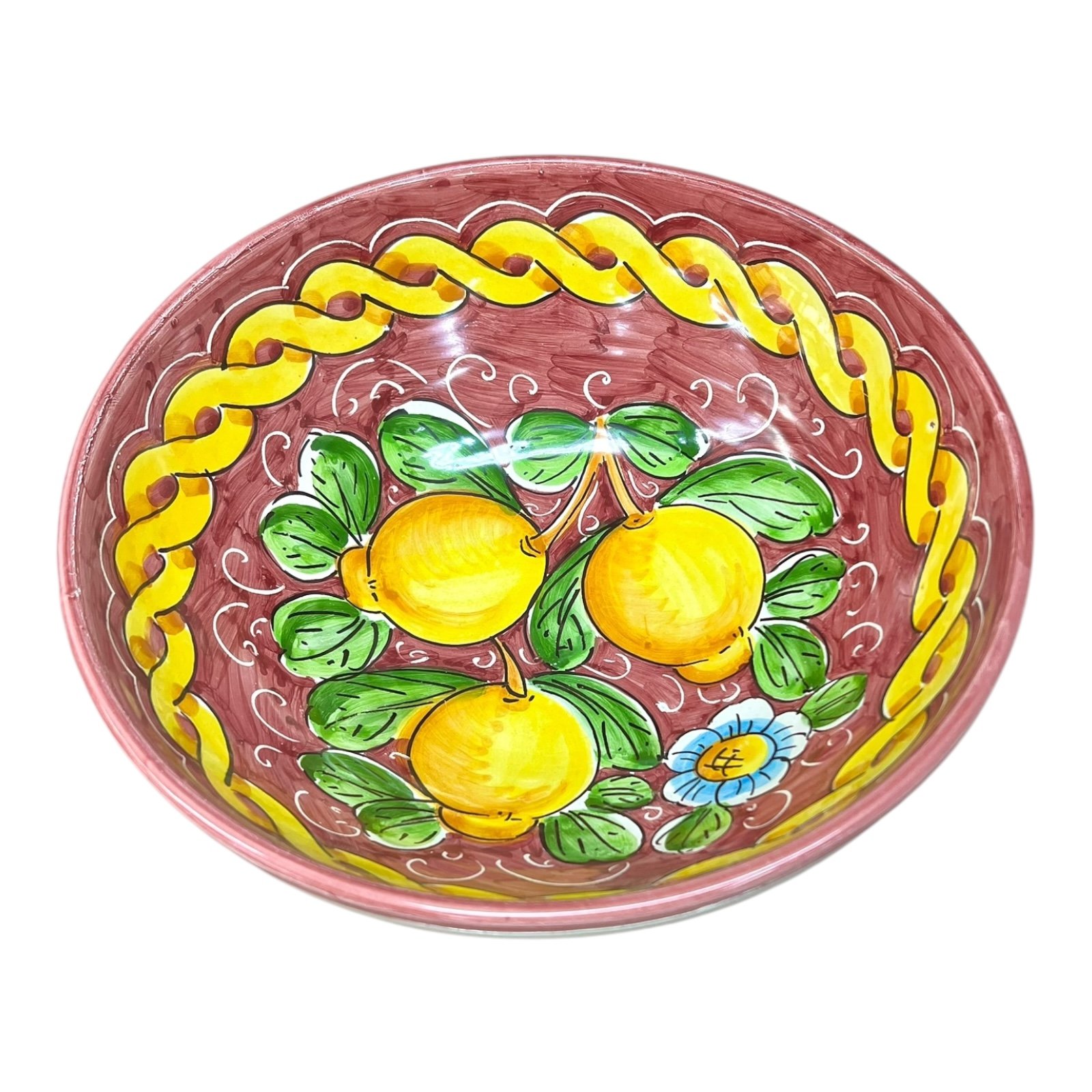 Ciotola centrotavola in ceramica siciliana con limoni decoro treccia fondo bordeaux Produzione artigianale di Santo Stefano di Camastra Diametro 25cm