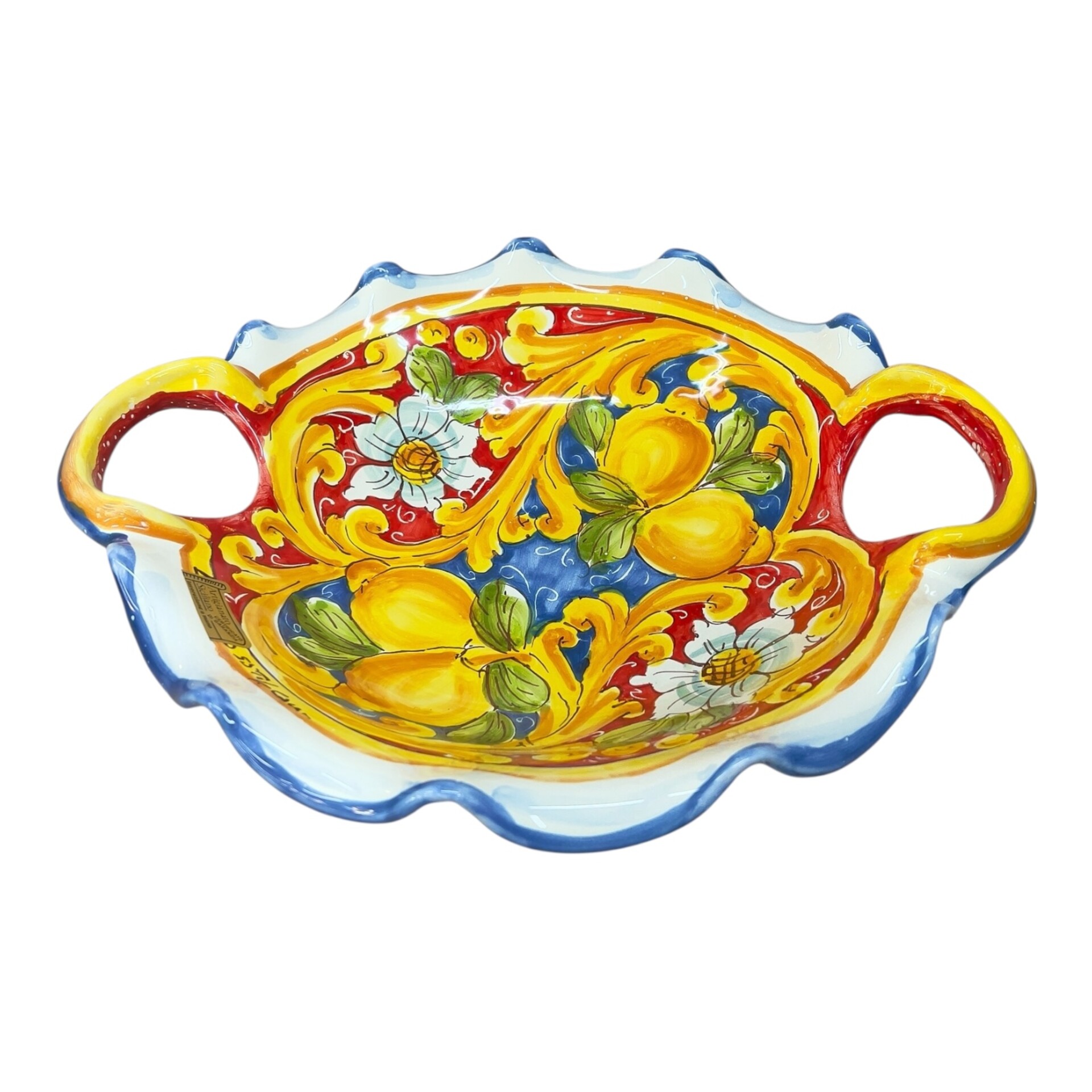 Centrotavola smerlato con manici in ceramica siciliana decoro con limoni fondo rosso e blu Produzione artigianale di Santo Stefano di Camastra lunghezza 30cm