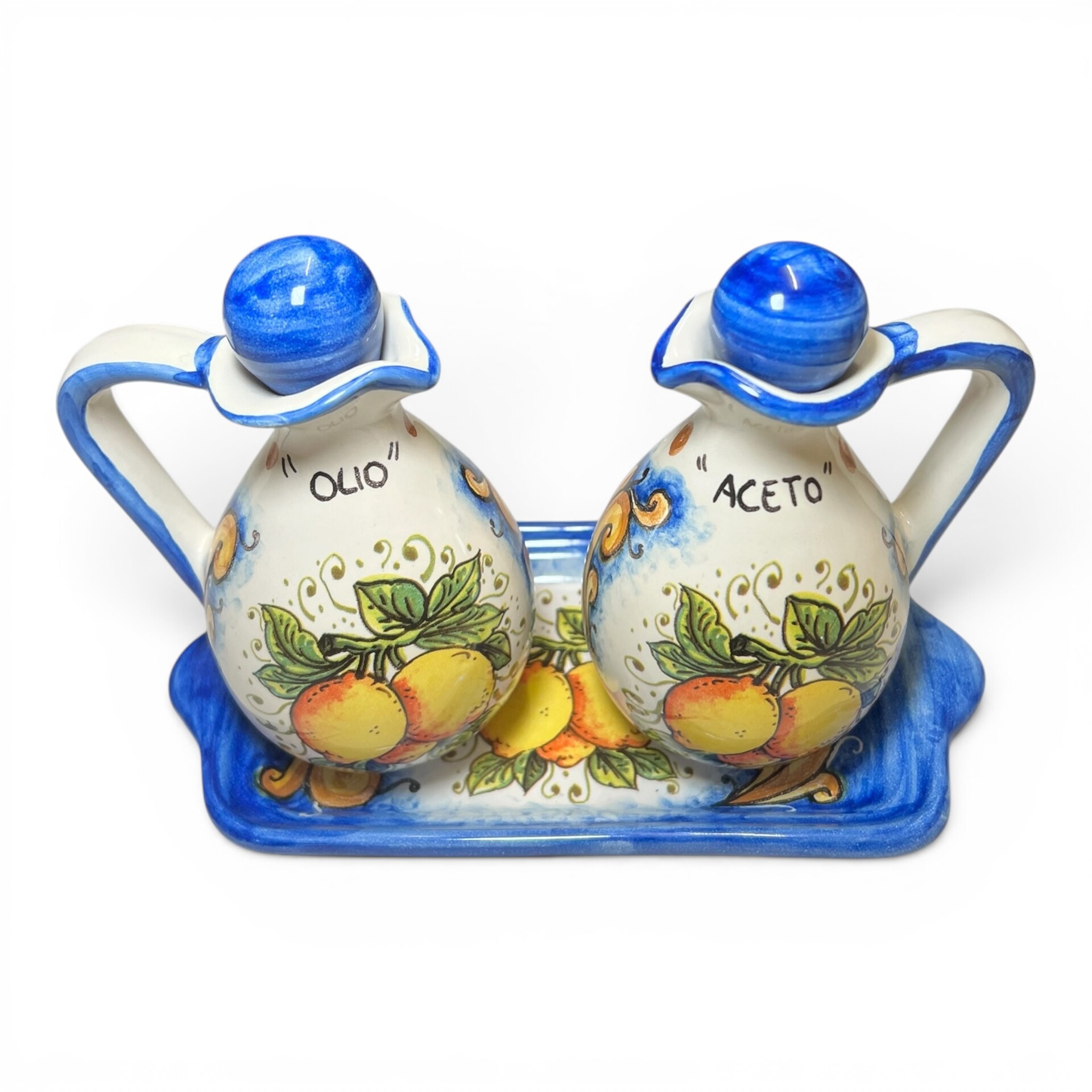 Set Olio e Aceto con vassoio decoro limoni ornato fondo blu in ceramica siciliana Produzione artigianale di Santo Stefano di Camastra h.18cm