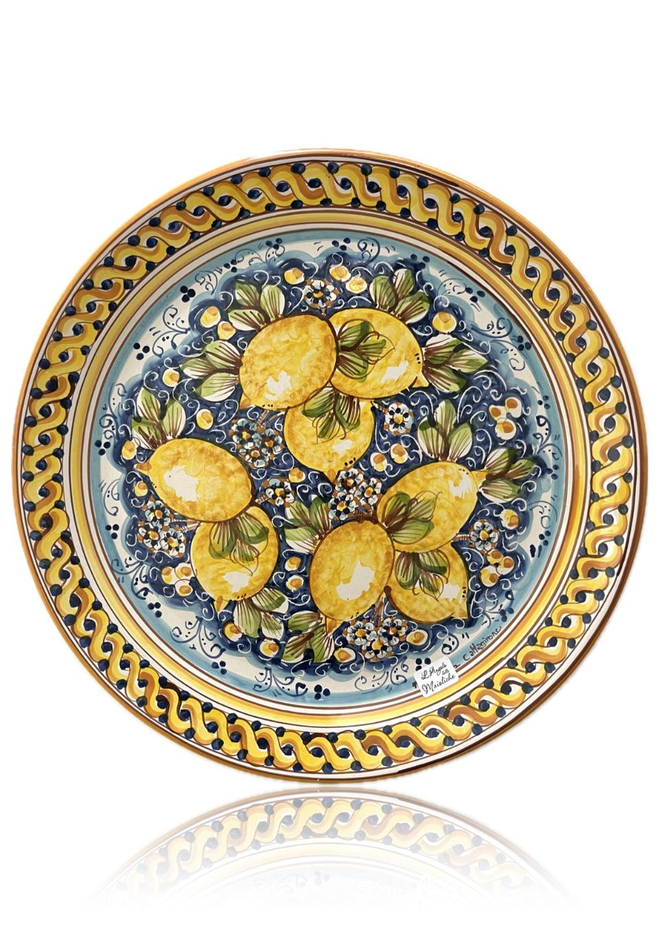 Piatto con limoni in ceramica siciliana da parete fondo blu Produzione artigianale di Caltagirone diametro 43cm