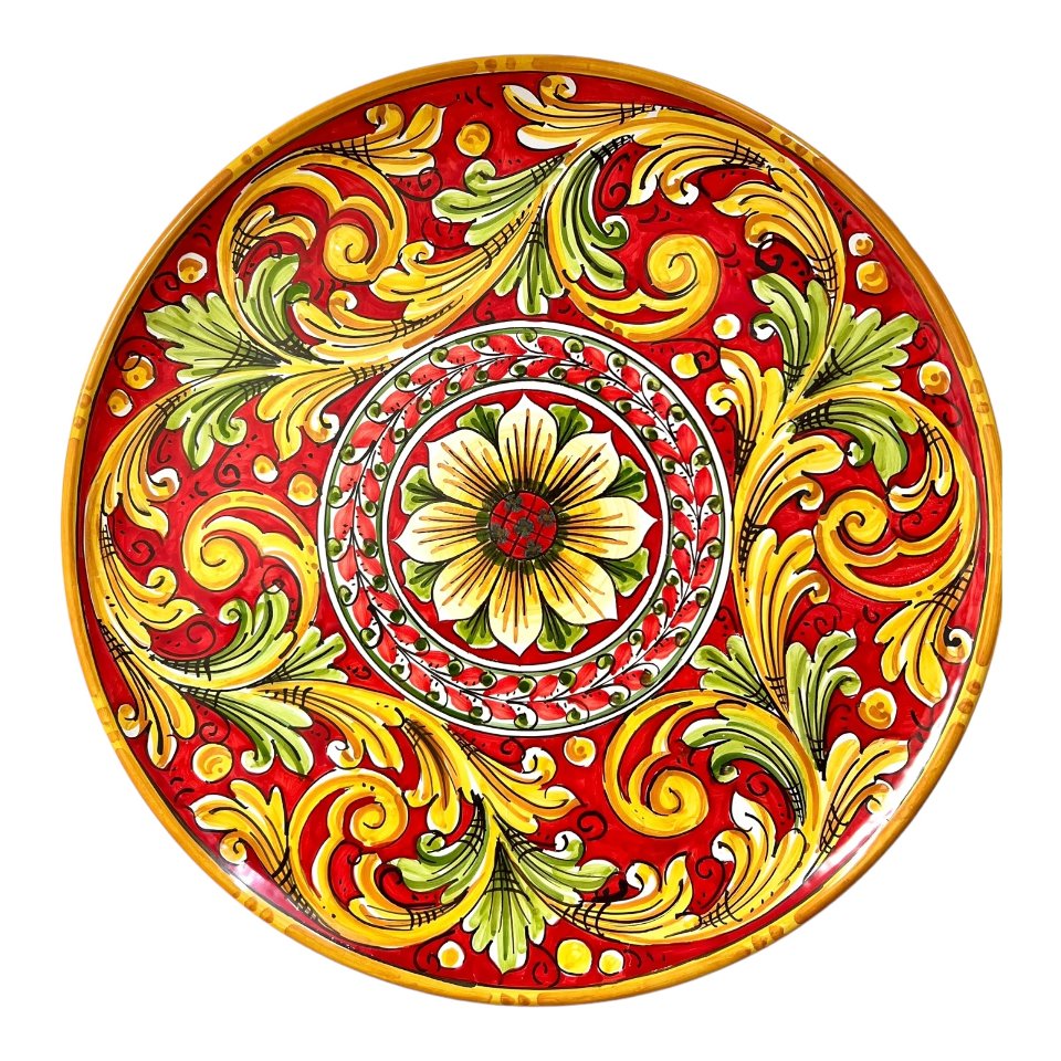 Piatto ornamentale da parete in ceramica siciliana fondo rosso decoro barocco rosso e giallo Produzione artigianale di Caltagirone Diametro 43cm