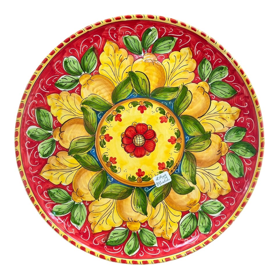 Piatto ornamentale da parete in ceramica siciliana con limoni fondo rosso Produzione artigianale di Santo Stefano di Camastra diametro 43cm