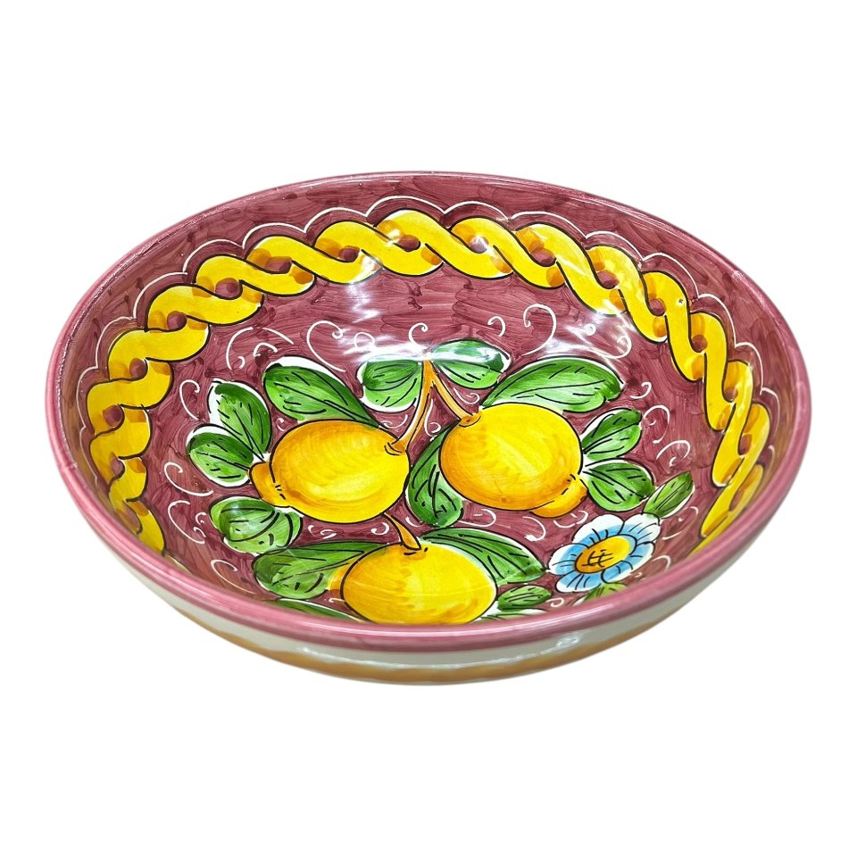 Ciotola centrotavola in ceramica siciliana con limoni decoro treccia fondo bordeaux Produzione artigianale di Santo Stefano di Camastra Diametro 25cm