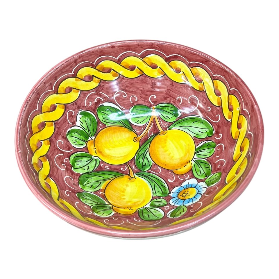Ciotola centrotavola in ceramica siciliana con limoni decoro treccia fondo bordeaux Produzione artigianale di Santo Stefano di Camastra Diametro 25cm