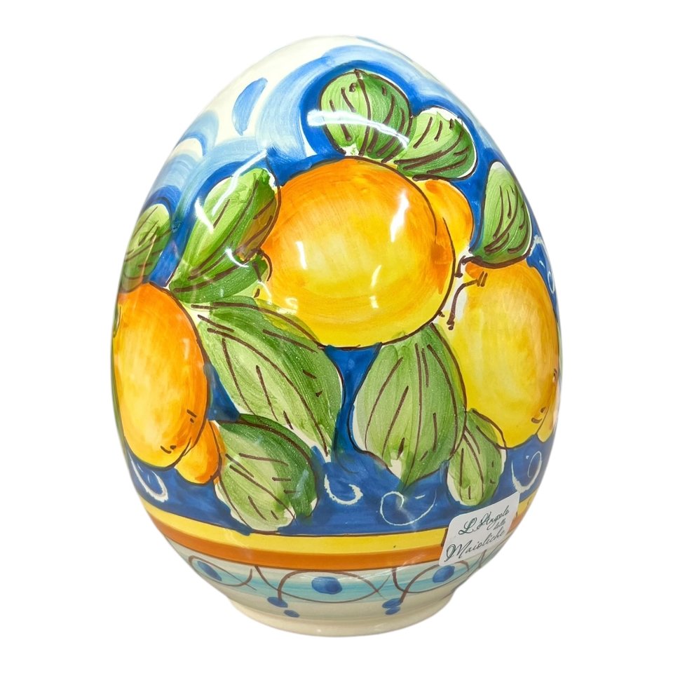 Uovo di Pasqua in ceramica siciliana con limoni e margherite fondo blu Produzione artigianale di Santo Stefano di Camastra h.20cm