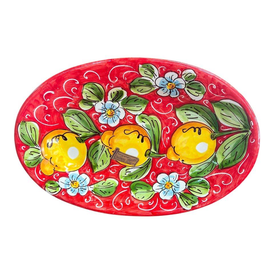 Piatto ornamentale ovale da parete in ceramica siciliana decoro con limoni fondo rosso Produzione artigianale di Santo Stefano di Camastra Lunghezza 30cm