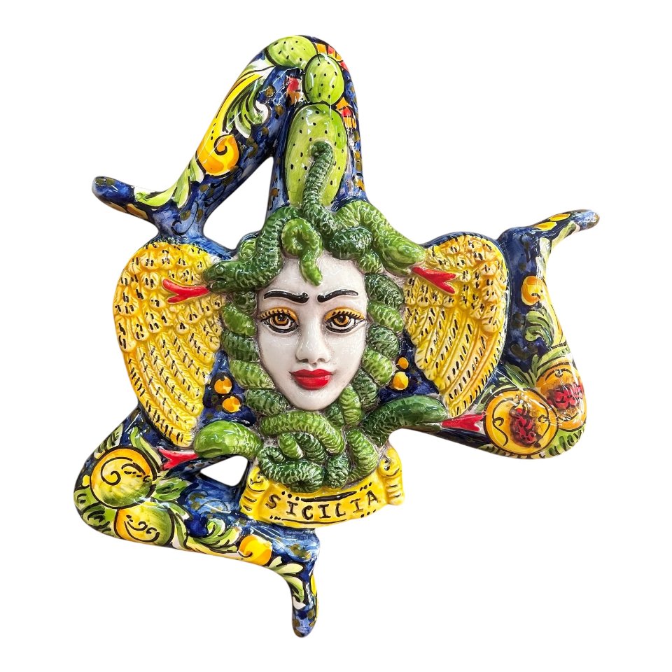 Trinacria ornamentale da parete decoro frutta su fondo blu in ceramica siciliana Produzione artigianale di Caltagirone Lunghezza 27cm