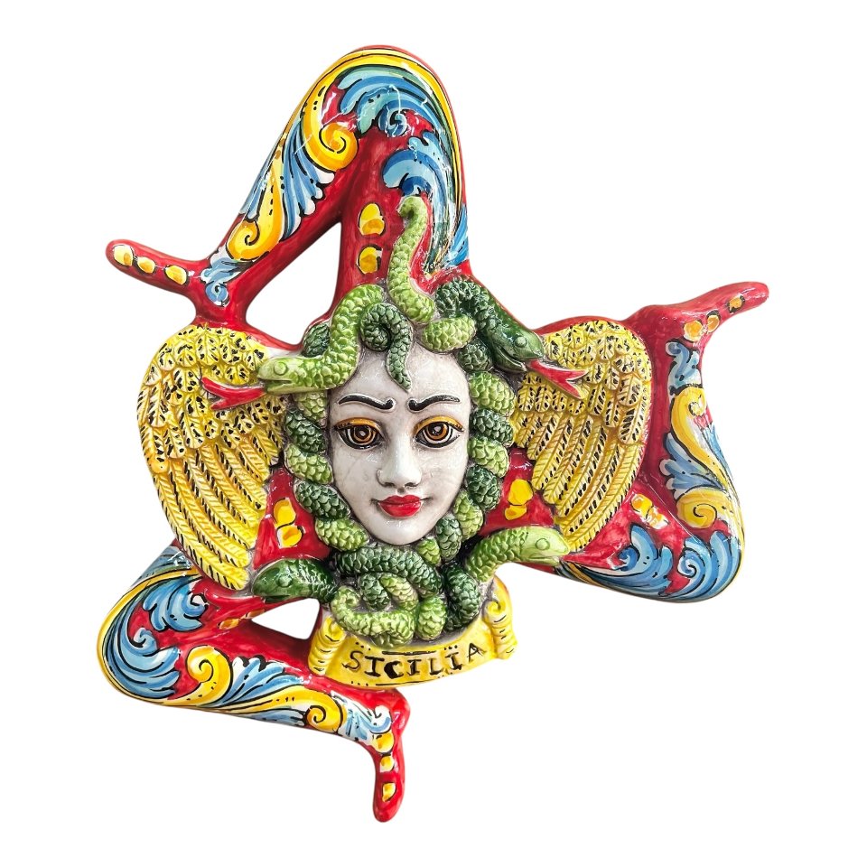 Trinacria ornamentale da parete in ceramica siciliana decoro ornato barocco fondo rosso Produzione artigianale di Caltagirone lunghezza 30cm