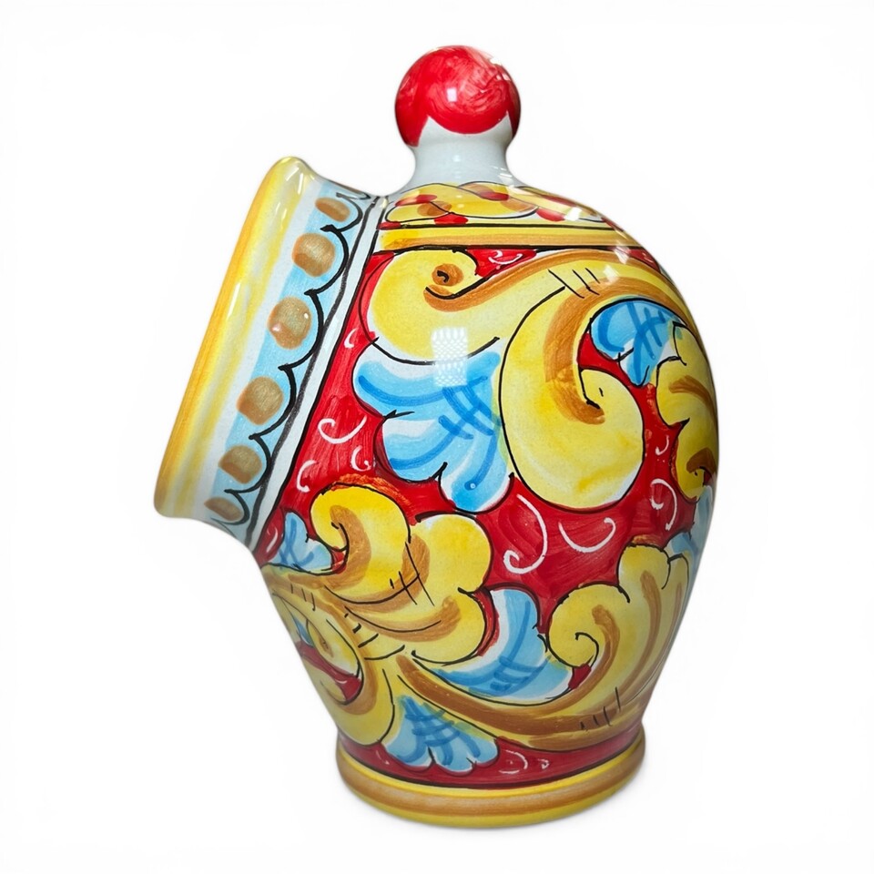 Saliera a salvadanaio in ceramica siciliana decoro barocco giallo e celeste fondo rosso Produzione artigianale di Santo Stefano di Camastra h.20cm