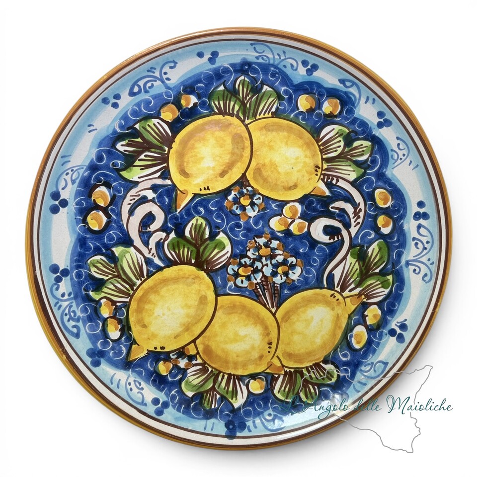 Piatto ornamentale da parete decoro limoni fondo blu in ceramica siciliana Produzione artigianale di Caltagirone diametro 26cm