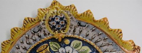 Piatto con limoni e melograni traforato in ceramica Produzione artigianale di Caltagirone  Lunghezza 45 cm