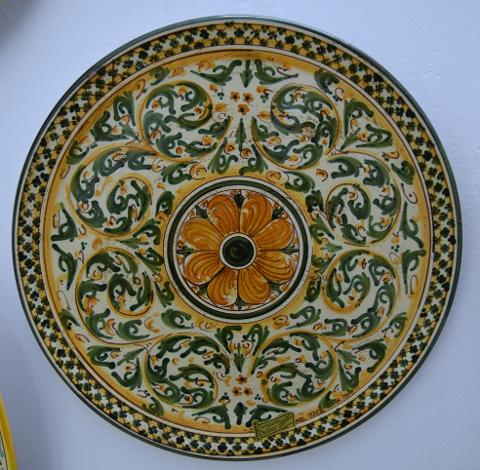 Piatto decoro floreale verde/arancio in ceramica da parete Produzione artigianale di Caltagirone  Diametro 30cm