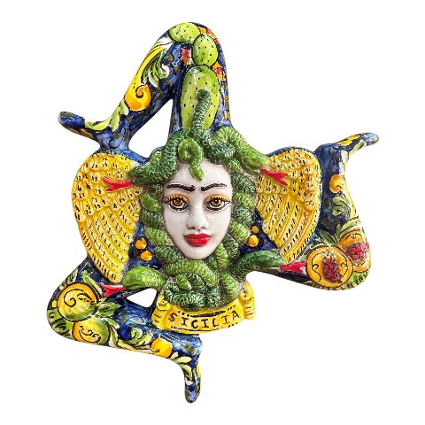 Trinacria ornamentale da parete decoro frutta su fondo blu in ceramica siciliana Produzione artigianale di Caltagirone Lunghezza 27cm