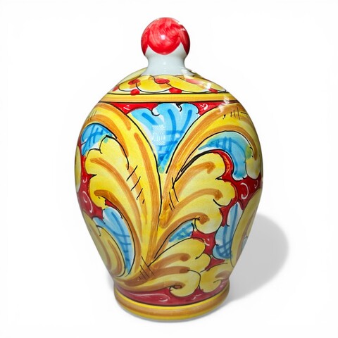 Saliera a salvadanaio in ceramica siciliana decoro barocco giallo e celeste fondo rosso Produzione artigianale di Santo Stefano di Camastra h.20cm