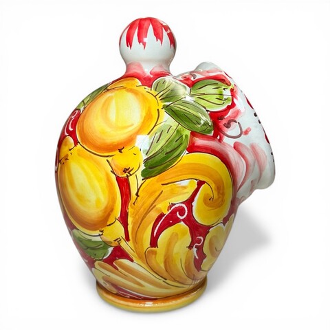 Saliera a salvadanaio in ceramica siciliana decoro barocco giallo con limoni fondo rosso Produzione artigianale di Santo Stefano di Camastra h.20cm