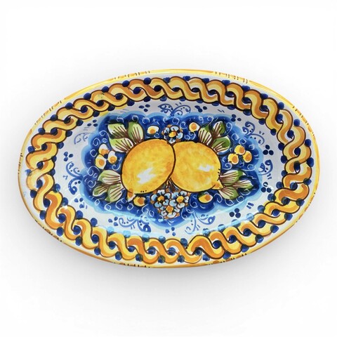 Piatto ornamentale ovale da parete decoro limoni treccia fondo blu in ceramica siciliana Produzione artigianale di Caltagirone varie misure