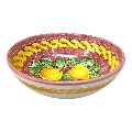 Ciotola centrotavola in ceramica siciliana con limoni decoro treccia fondo bordeaux Produzione artigianale di Santo Stefano di Camastra Diametro 25cm