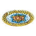 Piatto ornamentale ovale da parete in ceramica siciliana con melograni fondo blu Produzione artigianale di Caltagirone Lunghezza 22cm