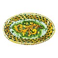 Piatto ornamentale ovale da parete in ceramica siciliana decoro ornato giallo e verde Produzione artigianale di Caltagirone Lunghezza 22cm