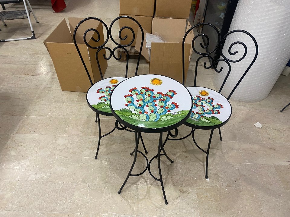 Set tavolo e sedie in ferro e ceramica Nino Parrucca