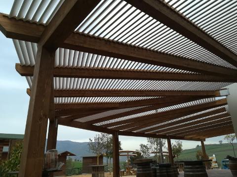PERGOLATO IN LEGNO LAMELLARE CON DOGHE INCLINATE CORSO LEGNAMI SRL PERGOLATO