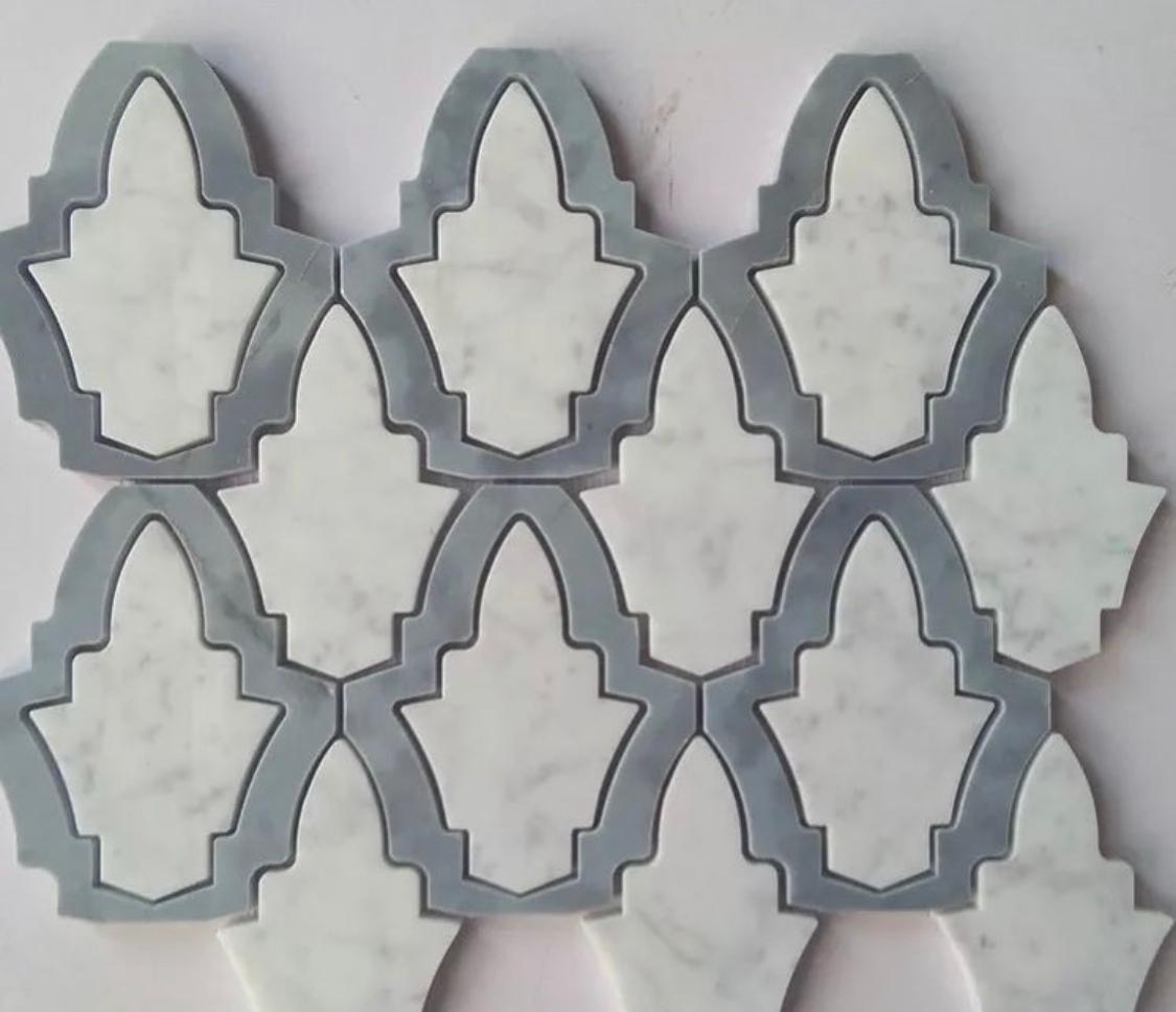 Pavimenti waterjet con intagli su marmo e graniti.