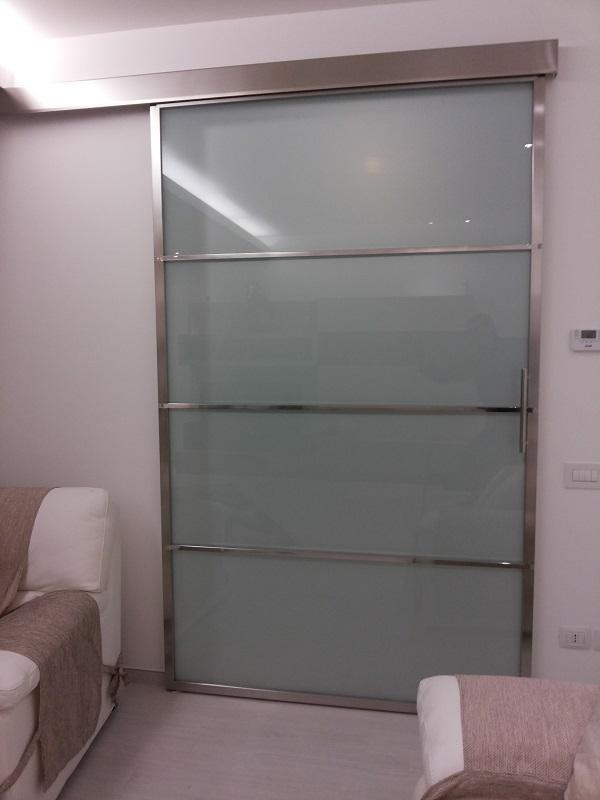PORTA SCORREVOLE IN ACCIAIO INOX.