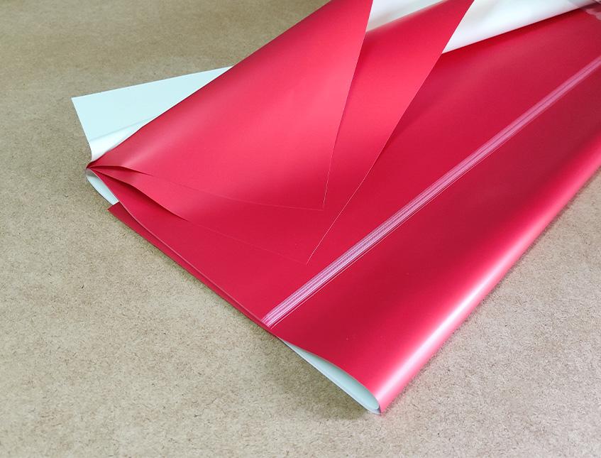 Fogli Cellofan 70X70 Bicolore  - Sconti per Fioristi e Aziende - Conf. 25 fogli Perla/Rosso